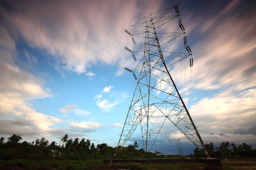 Stunning view of a towering power line against a vibrant sky, showcasing energy infrastructure in nature.